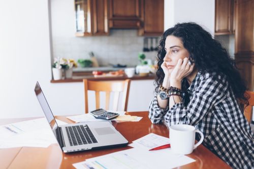 Young woman drinking coffee at home