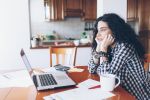 Young woman drinking coffee at home